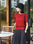 Waist-cinching button top